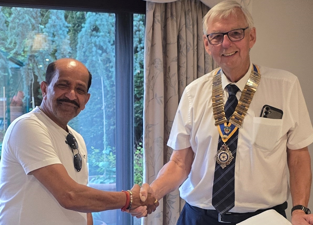President Richard with Ramesh as he joins Slough Rotary as our newest member